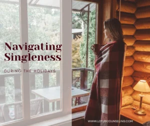 Woman wrapped in blanket looking out the window