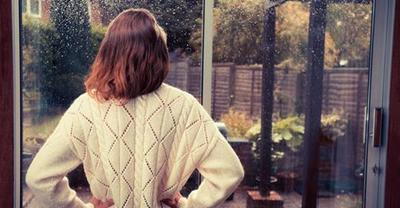 Woman looking out window