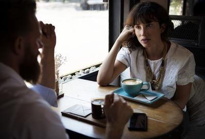 Man and woman drinking coffee