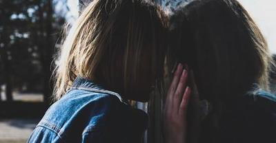 Stressed out woman leaning on window